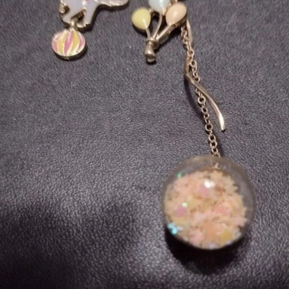 Circus high low earrings